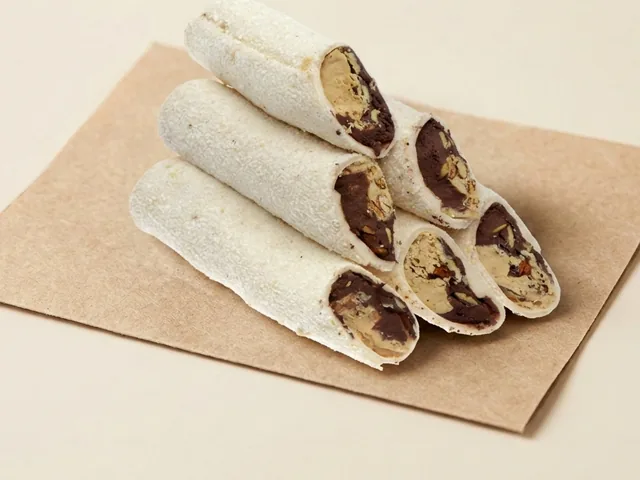 Coconut coated double cream and nuts roll